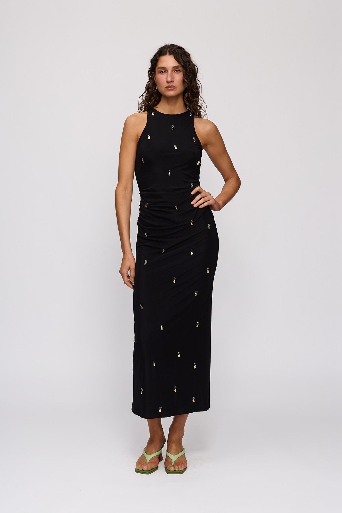 Melba Midi Dress in Noir by The Wolf Gang – front view, hand on hip
