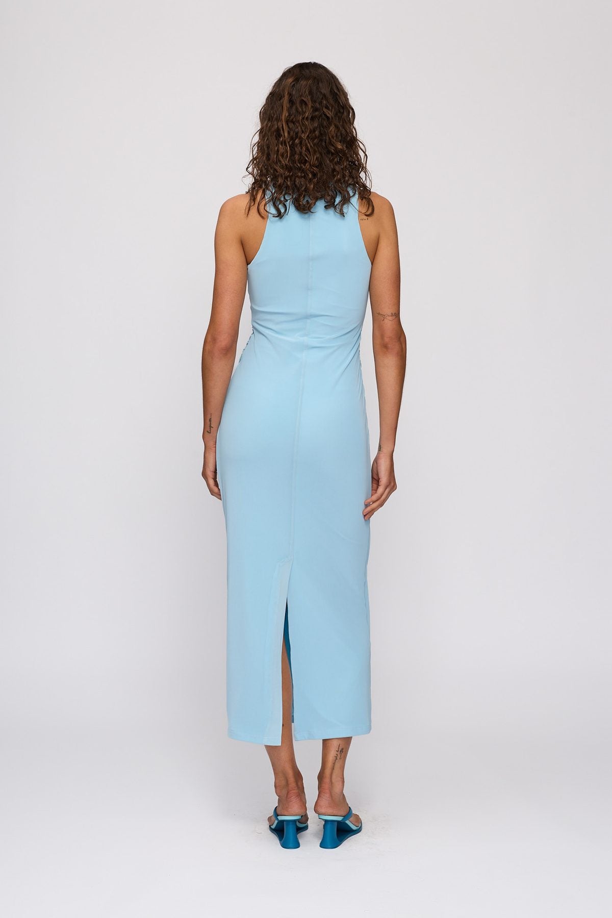 Melba Midi Dress in Sky by The Wolf Gang – back view showing split