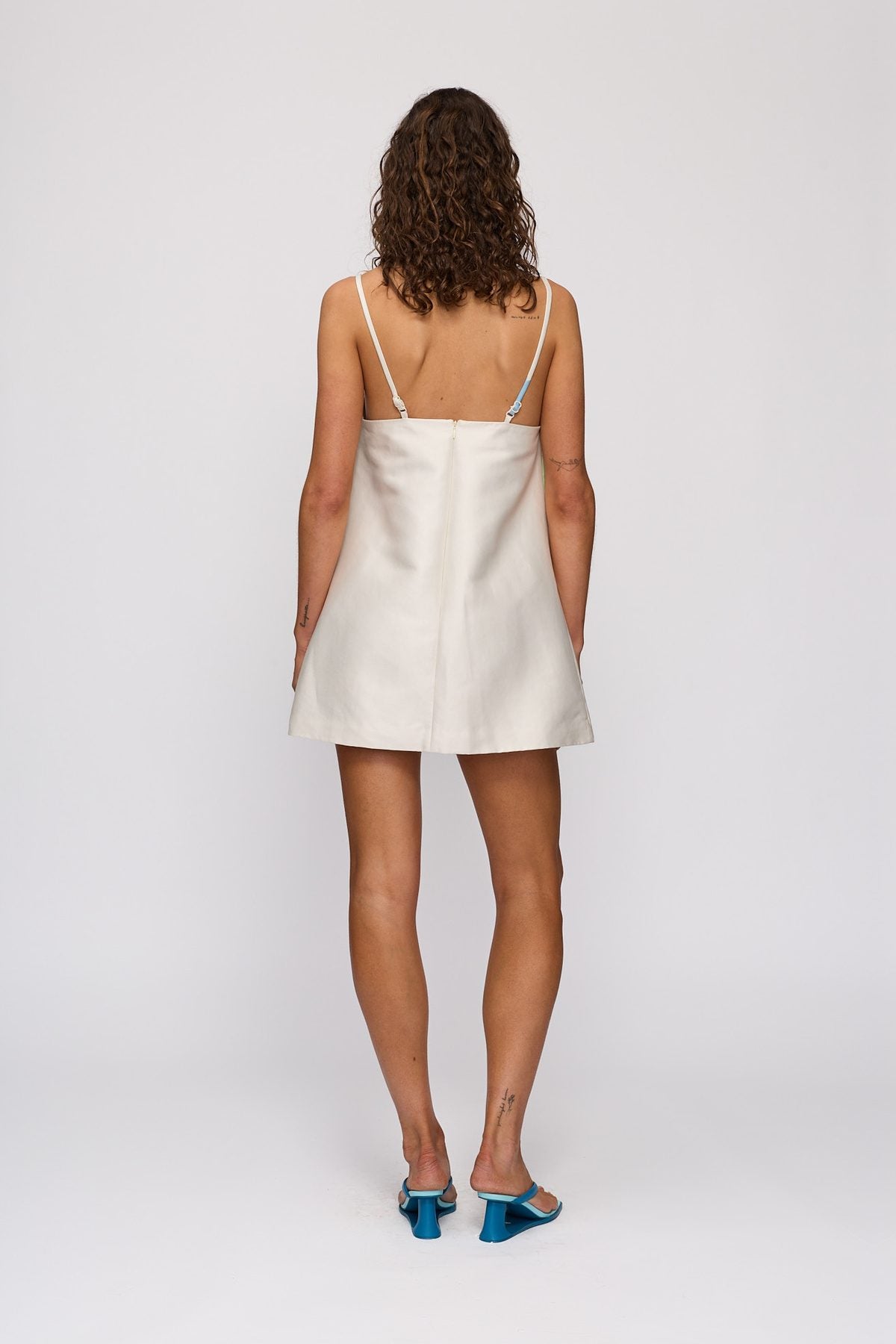 Palma Mini Dress in Ocean Lily by The Wolf Gang – back view
