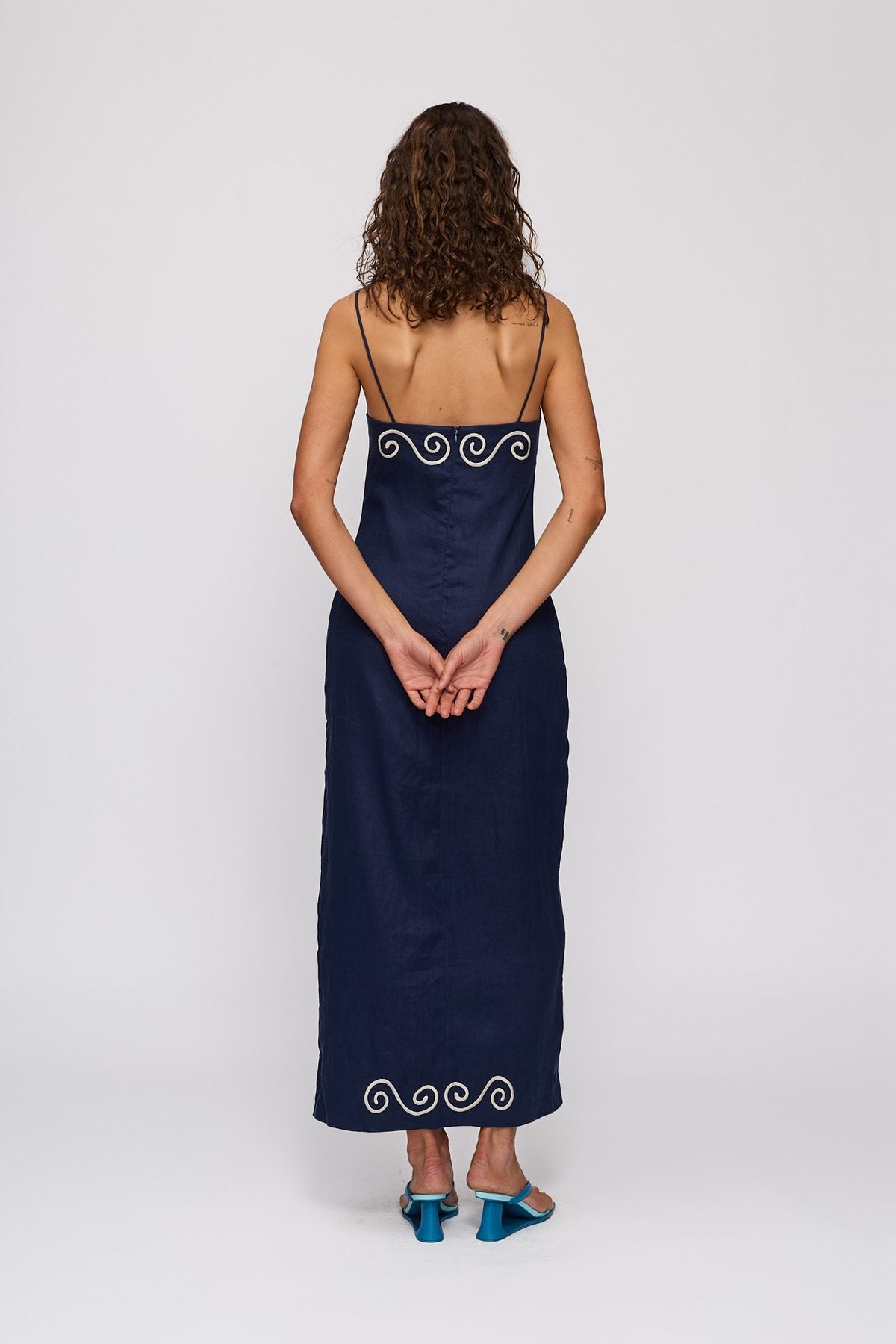 Seren Midi Dress in Navy by The Wolf Gang – back view showing zip and corded detail