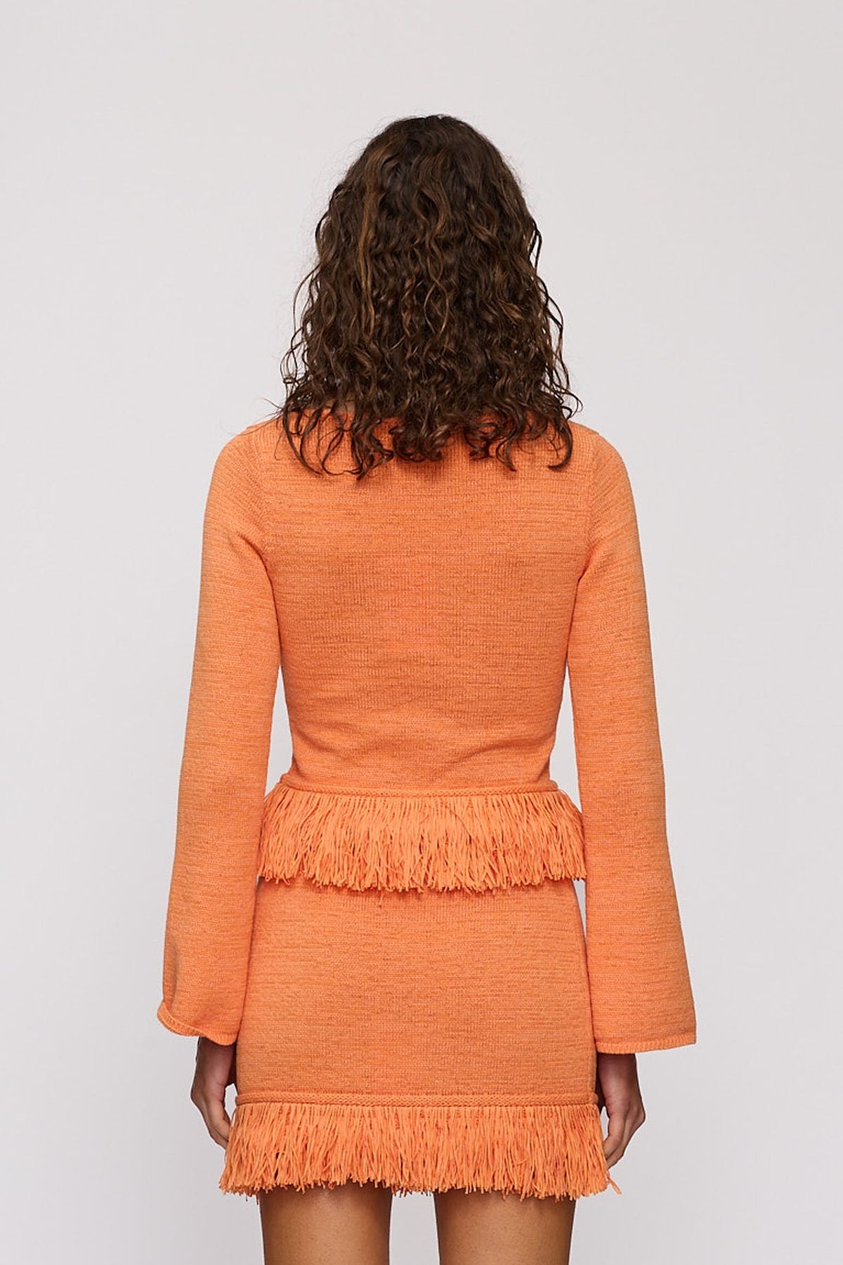 Tully Long Sleeve in Tangerine by The Wolf Gang – close-up view