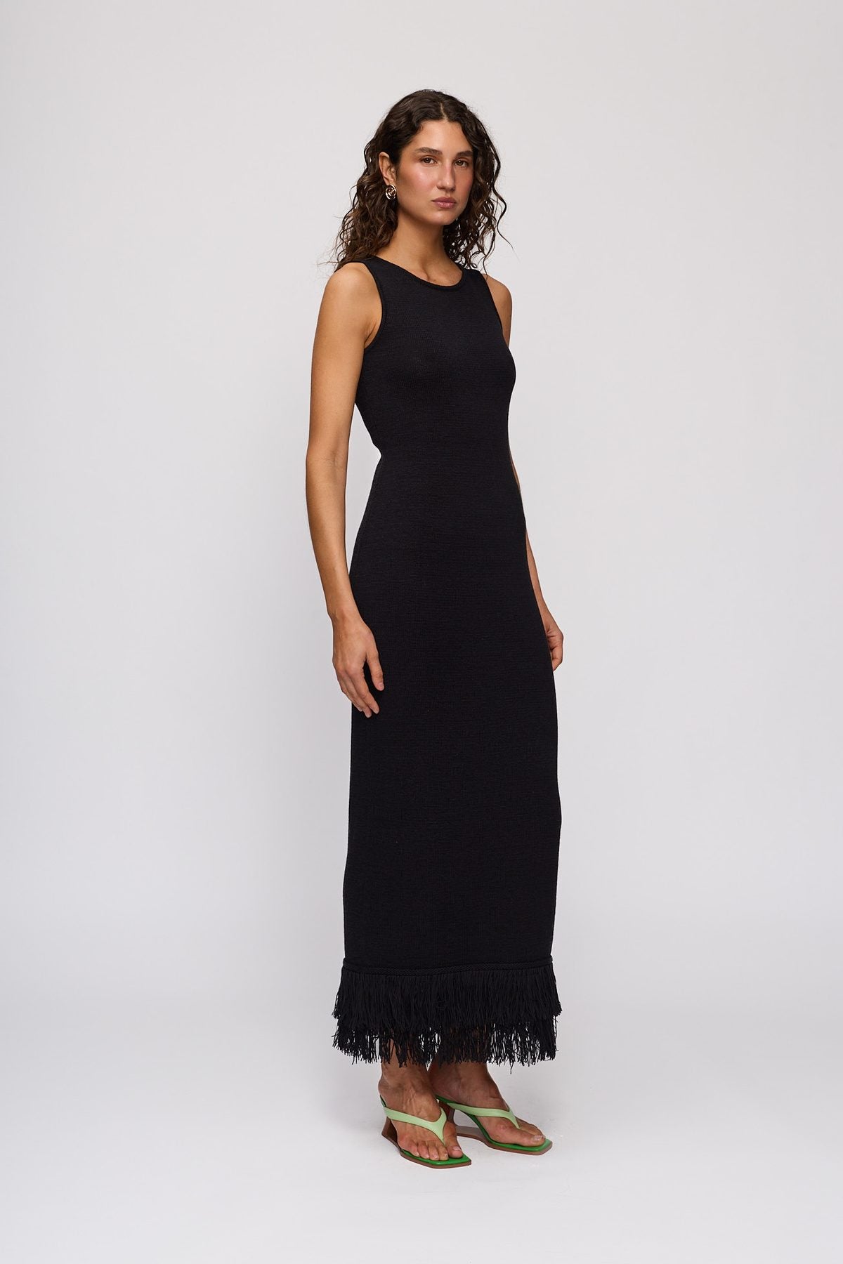 Tully Midi Dress in Noir by The Wolf Gang – three-quarter side view