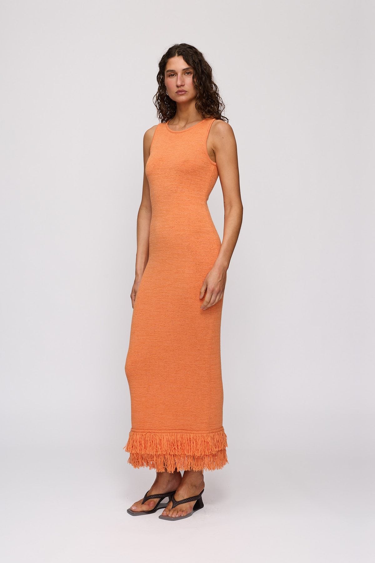 Tully Midi Dress in Tangerine by The Wolf Gang – three-quarter side view