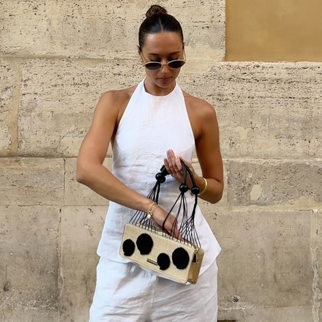 Bella wears the Thea Applique Shoulder Bag