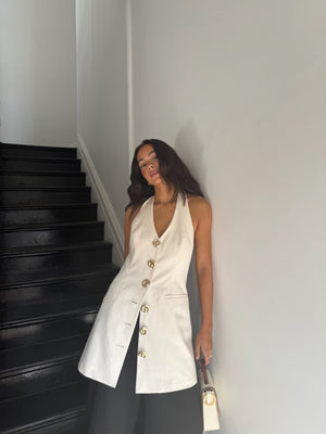 Delani wears the Irida Vest Dress in S 