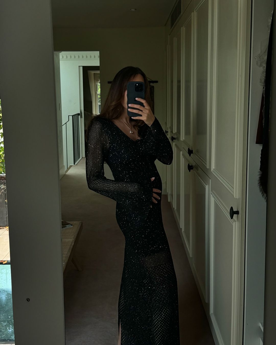 Ella wears the Coi Sequin Dress in S 