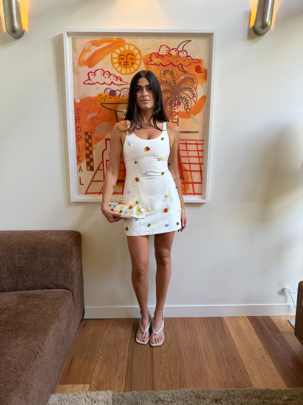 Summer wears the Romy Dress in size S