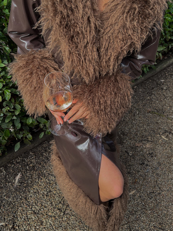 Dani wears the Abrigo Coat in size S
