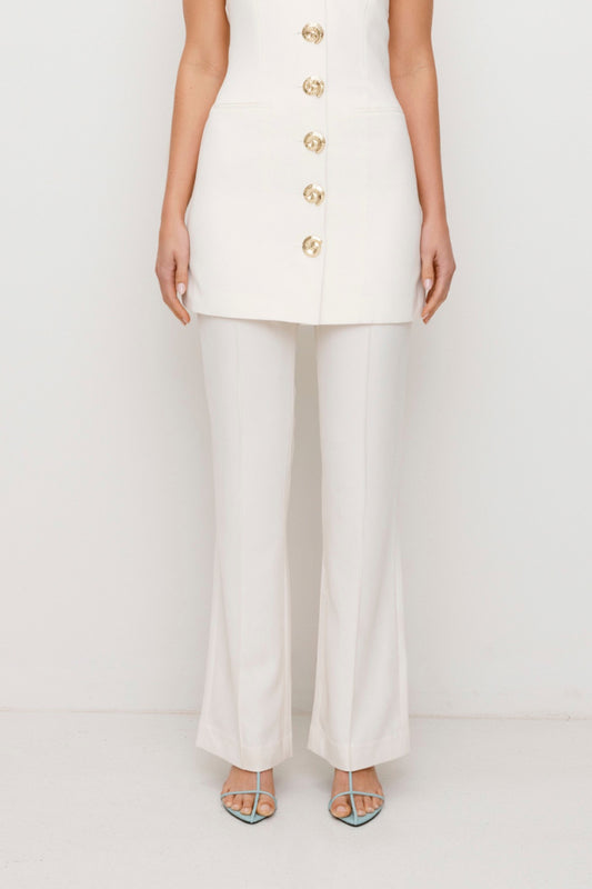 Women’s highwaisted Ivory White Irida Bootcut Pants perfect for brides with pin tuck detail and embroidered waistband—wear solo or as a matching set with Irida Vest Dress.