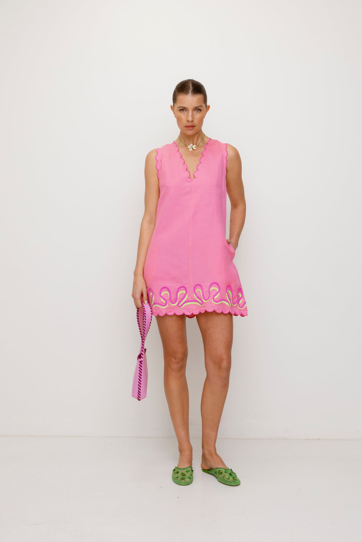 Women’s Candy Pink Mara Shoulder Bag in 100 percent leather with twisted strap contrast binding and magnetic snap closure for everyday wear.