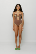Hand-crocheted halter neck one-piece swimsuit with floral patterns and contrast piping by The Wolf Gang, limited edition design.