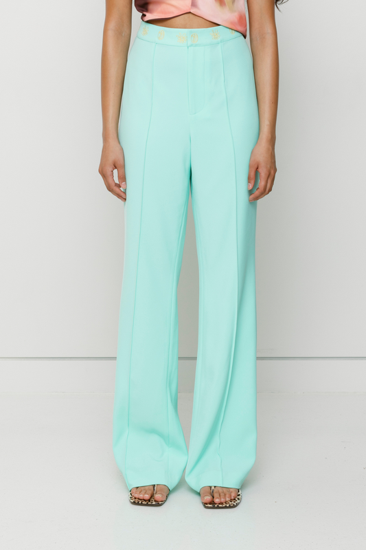 Tailored flared Inka pants with pintuck detail and custom waistband embroidery by The Wolf Gang, styled for a coordinated outfit with Inka Mini Dress.