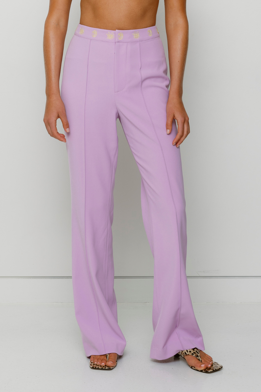 Tailored flared Inka pants with pintuck detail and custom waistband embroidery by The Wolf Gang, styled for a coordinated outfit with Inka Mini Dress.