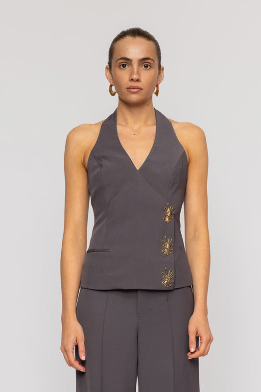 Halterneck vest top in butter yellow or charcoal grey with asymmetric closure and custom hardware by The Wolf Gang, styled with jeans or matching Pants.