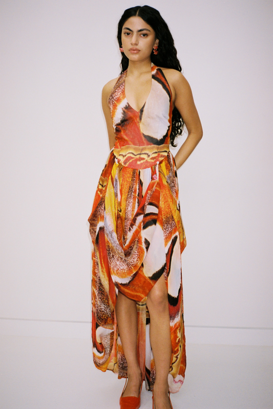 Versatile sheer Rumi Maxi Dress with adjustable skirt buttons by The Wolf Gang, customizable length for day or night wear.