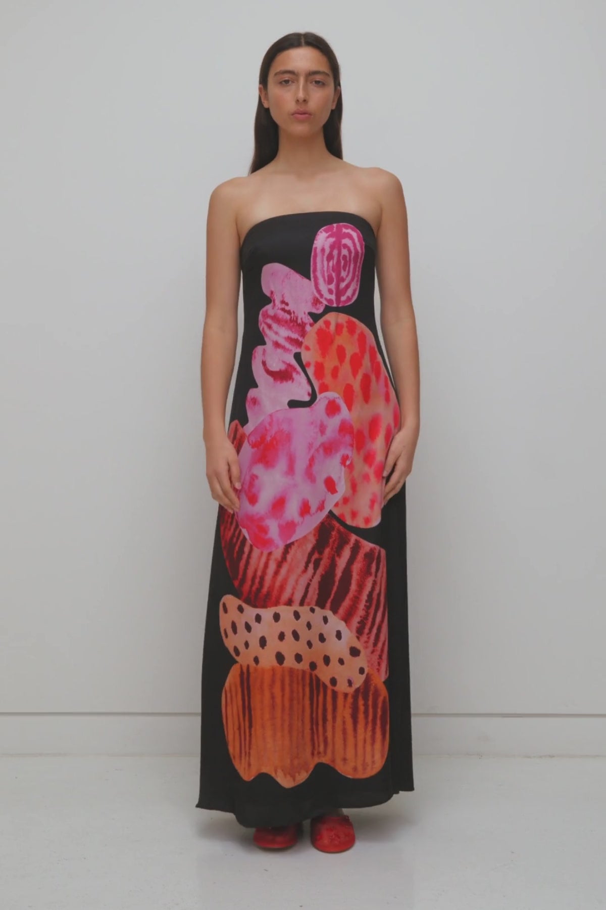 Women’s strapless Black Noir Kora Maxi Dress with asymmetric cowl neckline, abstract print, and invisible zip—perfect for events or long lunches.