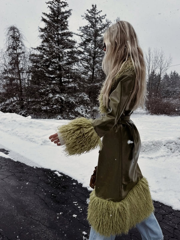 Halley wears the Abrigo Coat in XS