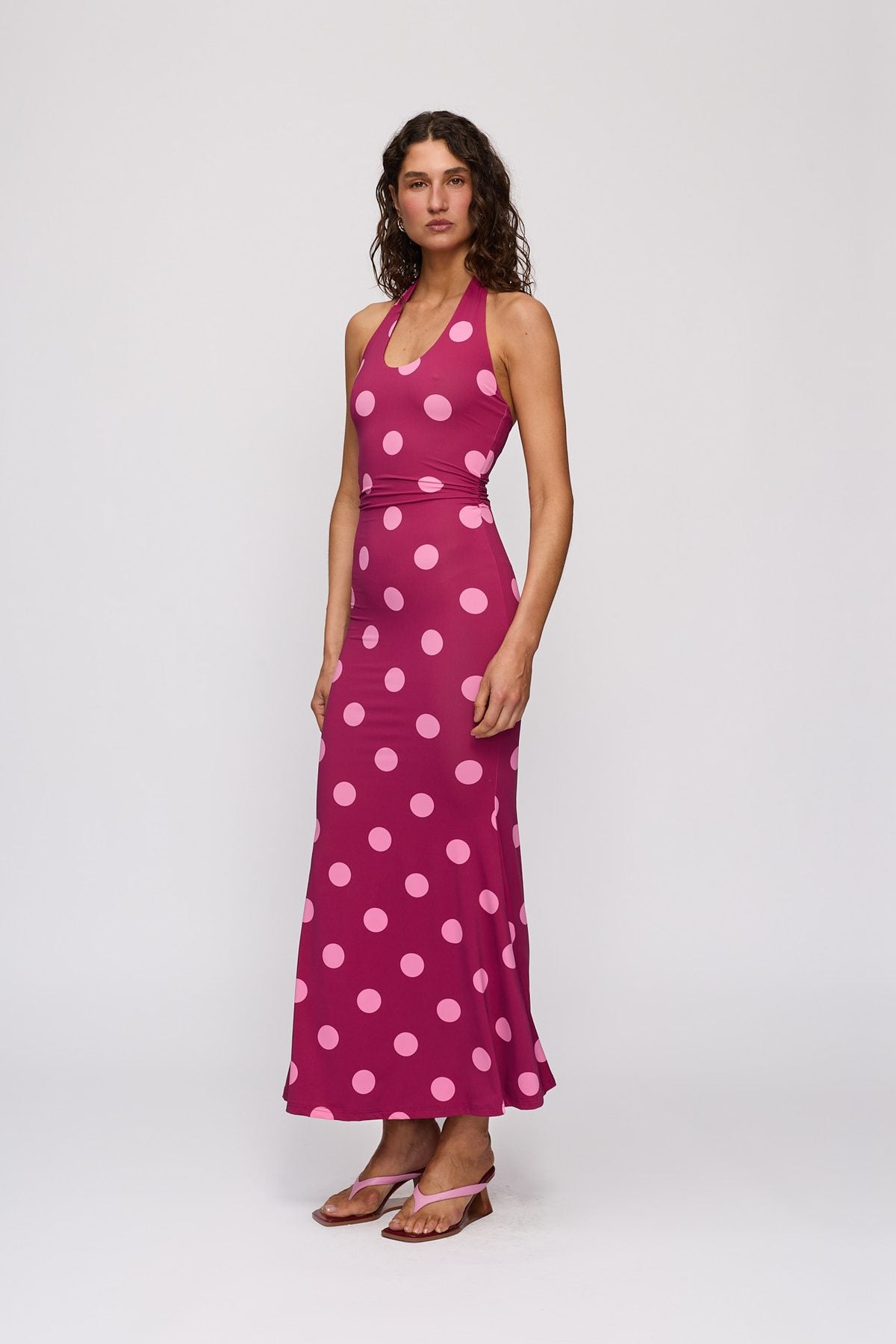 Giro Halter Dress in Berry Spot by The Wolf Gang – three-quarter side view