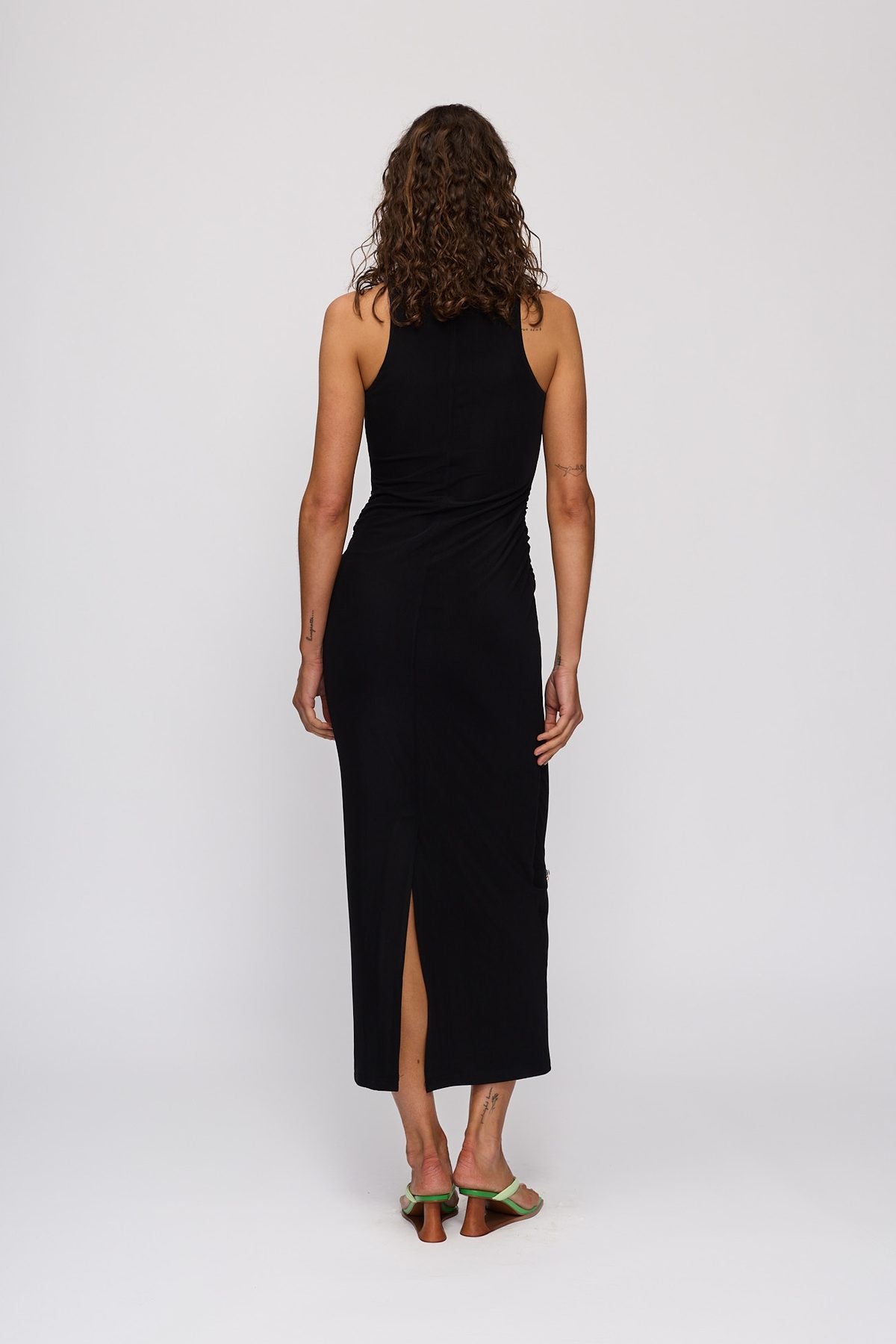 Melba Midi Dress in Noir by The Wolf Gang – back view showing split