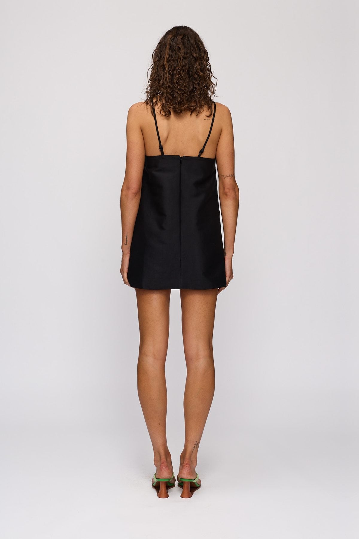 Palma Mini Dress in Noir by The Wolf Gang – back view showing zip