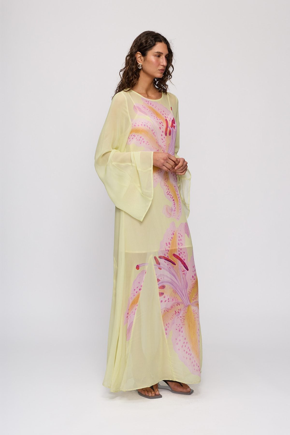 Solsana Maxi Dress in Candy Hibiscus by The Wolf Gang – side view showing flared sleeve