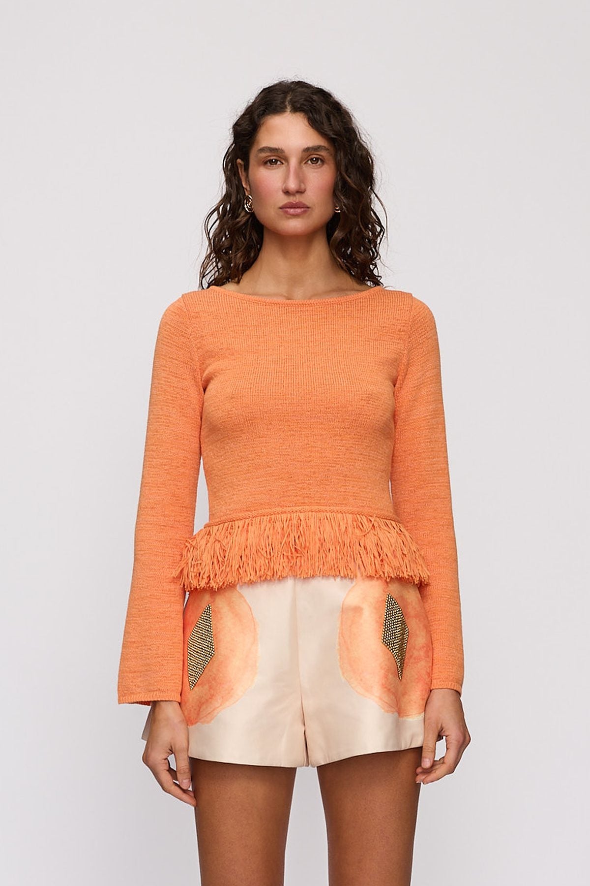Tully Long Sleeve in Tangerine by The Wolf Gang – close-up view