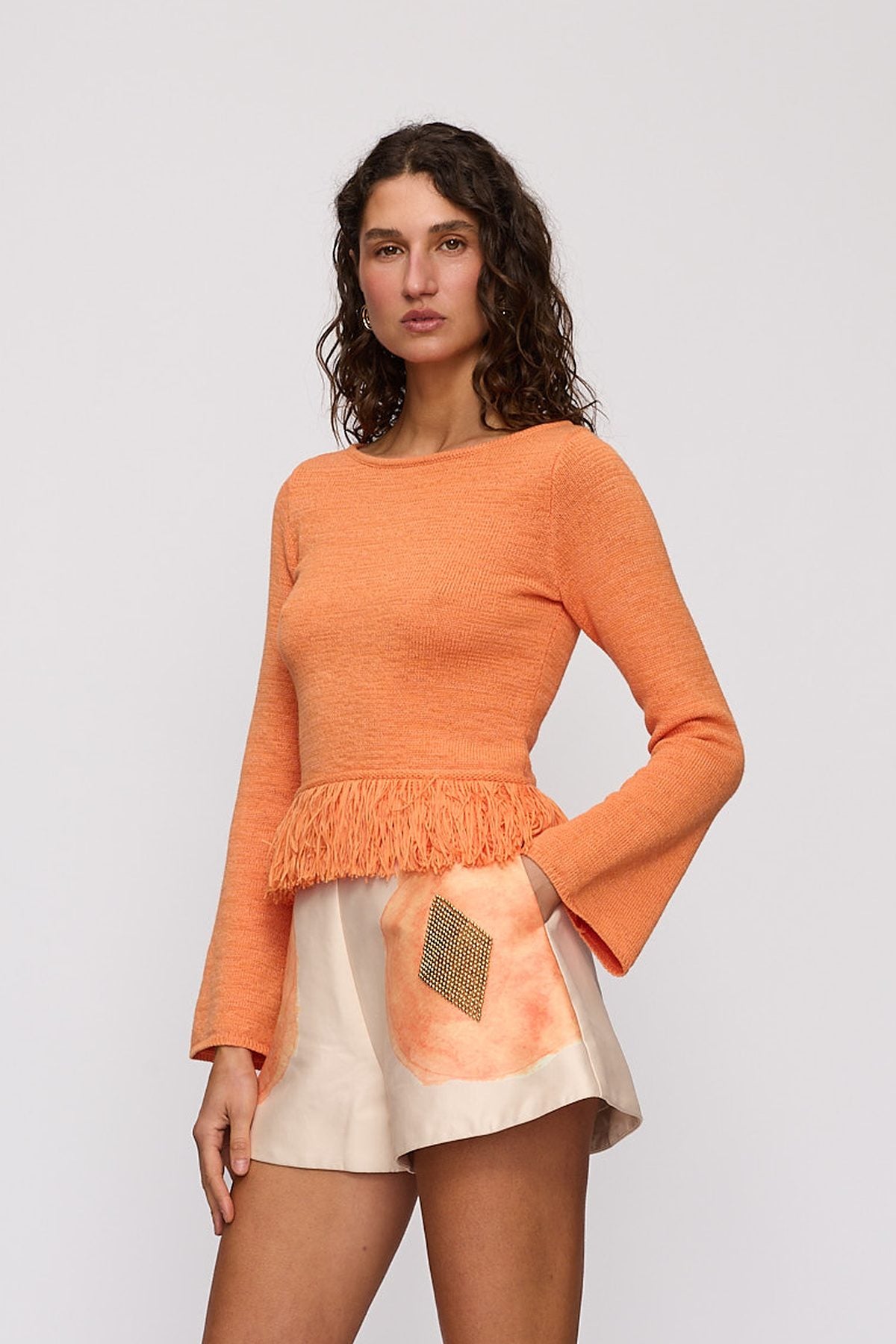 Tully Long Sleeve in Tangerine by The Wolf Gang – close-up view