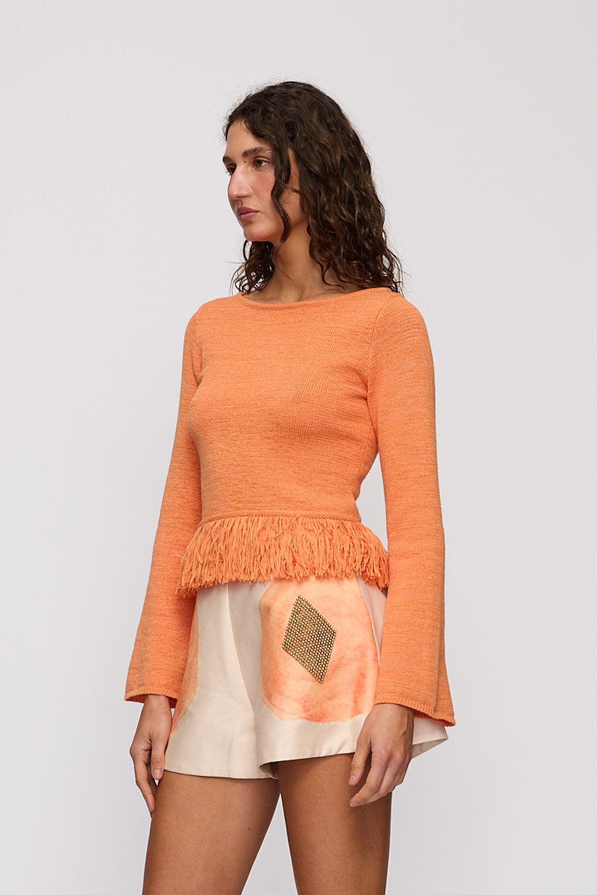 Tully Long Sleeve in Tangerine by The Wolf Gang – close-up view