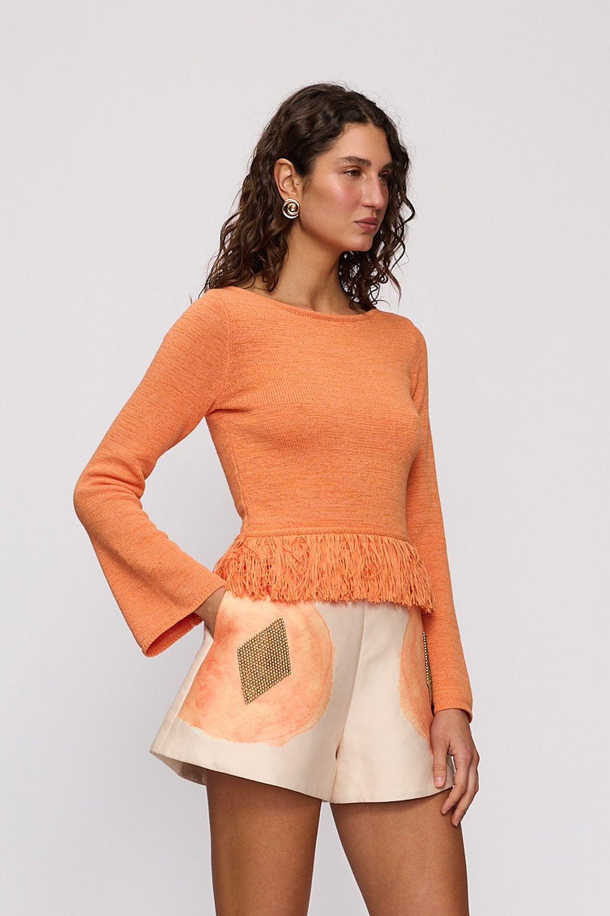 Tully Long Sleeve in Tangerine by The Wolf Gang – close-up view