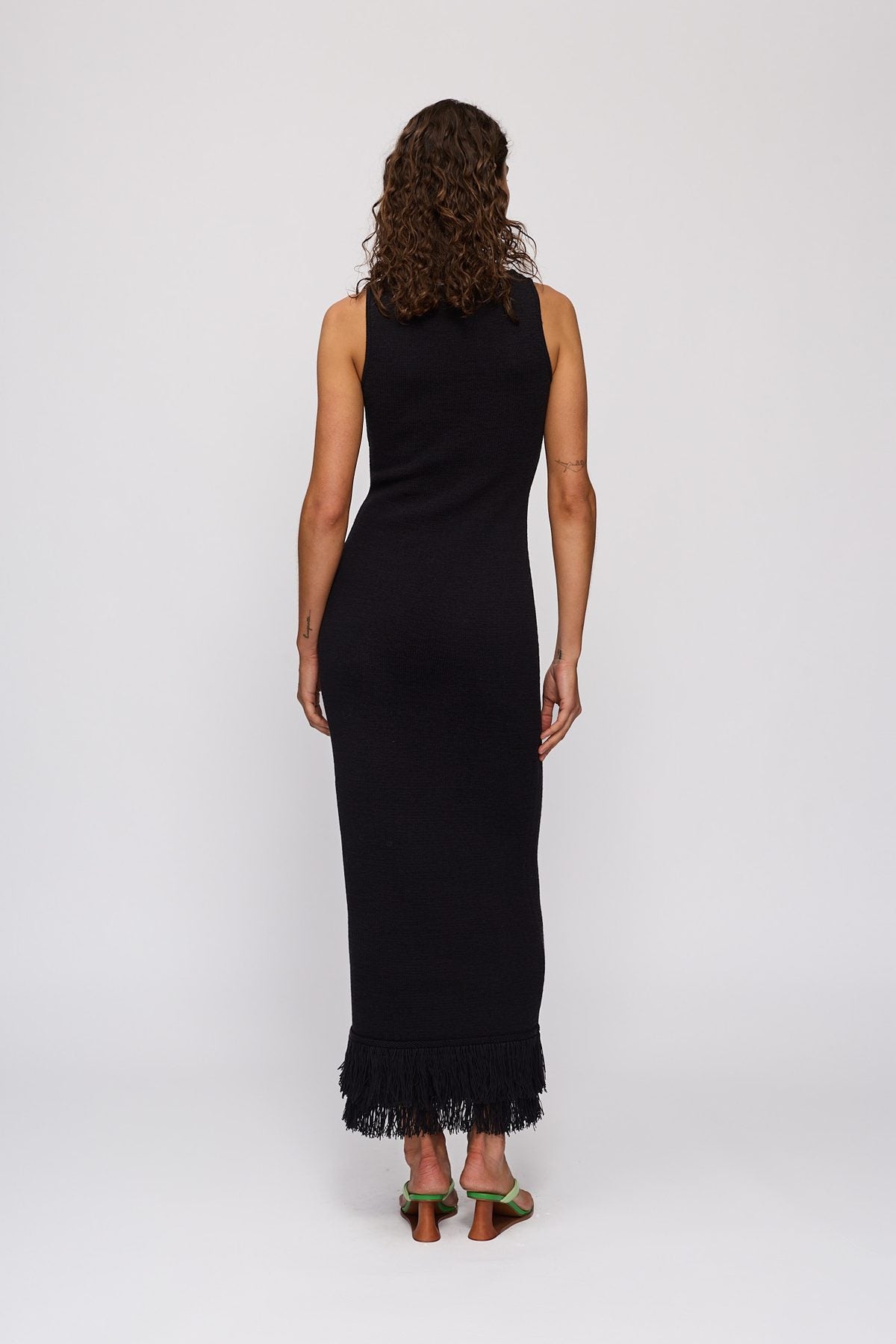 Tully Midi Dress in Noir by The Wolf Gang – back three-quarter view