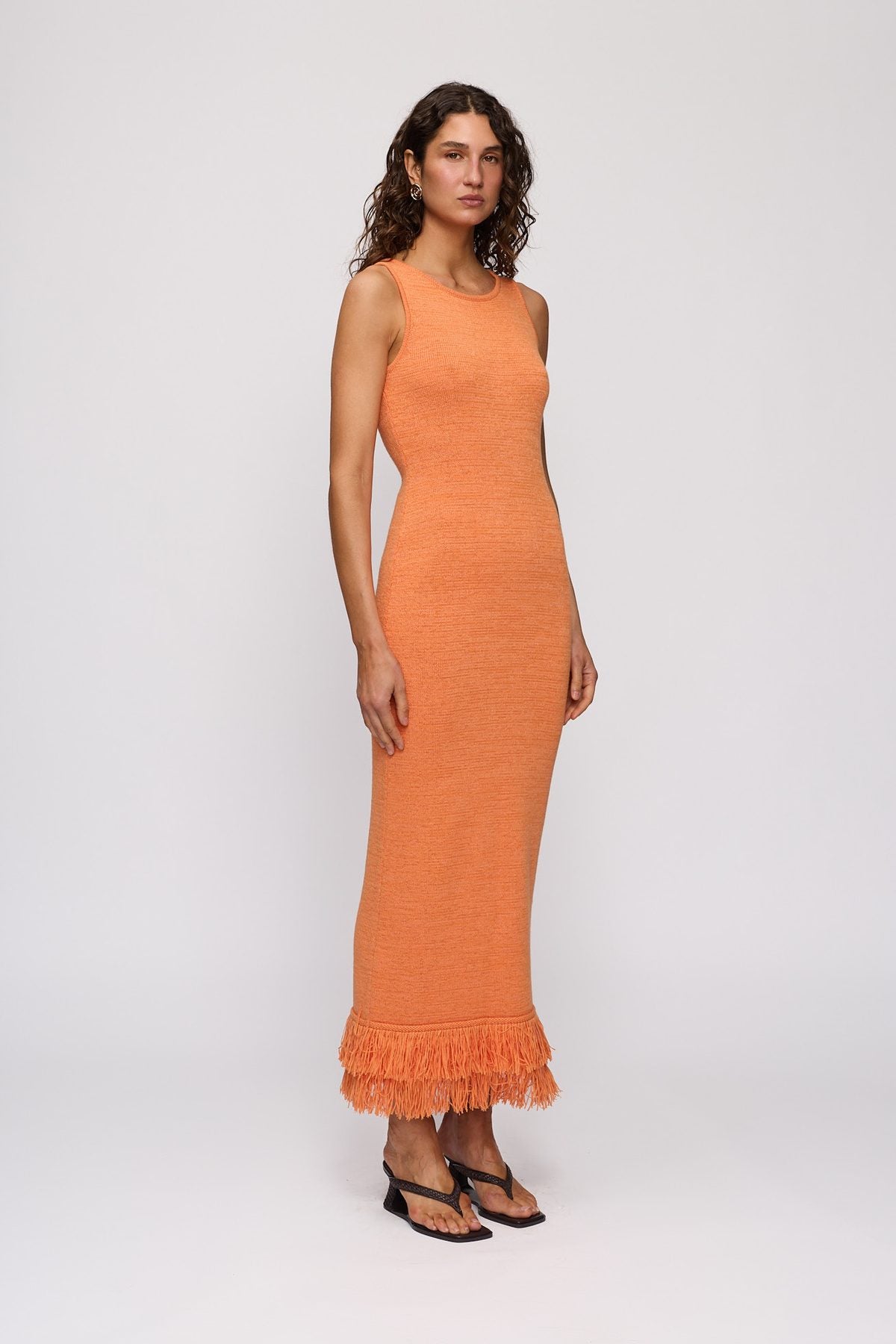Tully Midi Dress in Tangerine by The Wolf Gang – side view