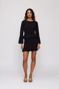 Tully Mini Skirt in Noir by The Wolf Gang – front full-length view (styled with Tully Long Sleeve)