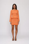 Tully Mini Skirt in Tangerine by The Wolf Gang – front full-length view (styled with Tully Long Sleeve)